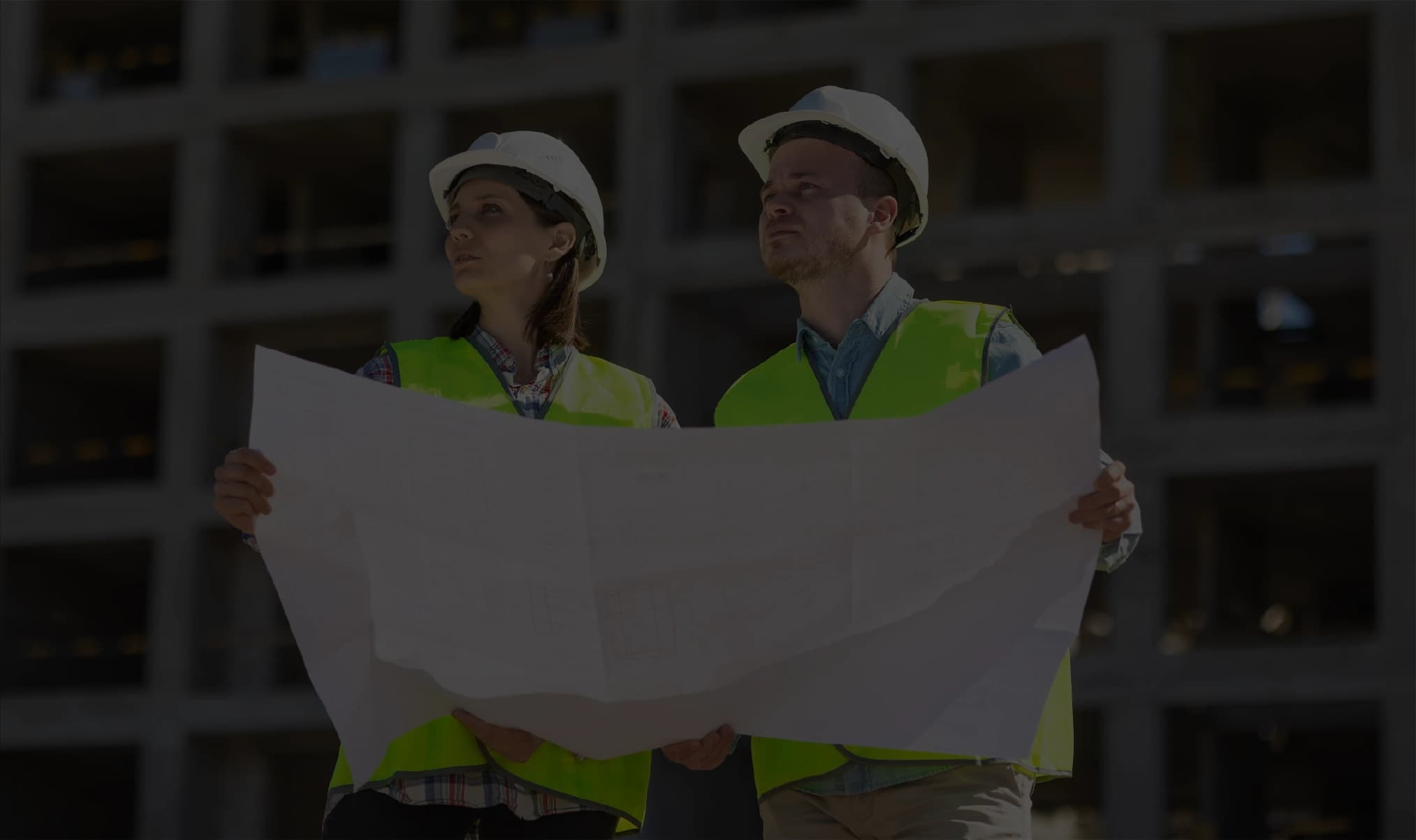 Construction workers with plans