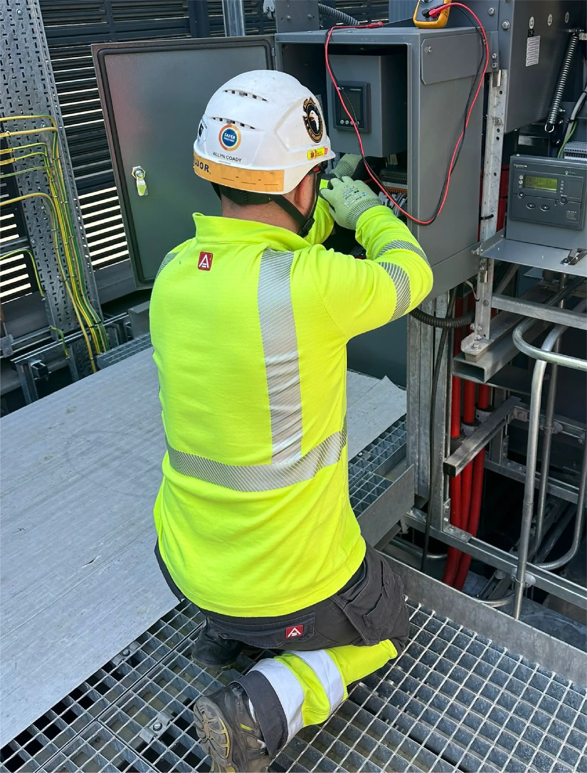 Construction site with workers and cranes